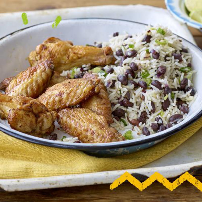 Caribbean Jerk kipvleugels met rijst en erwten